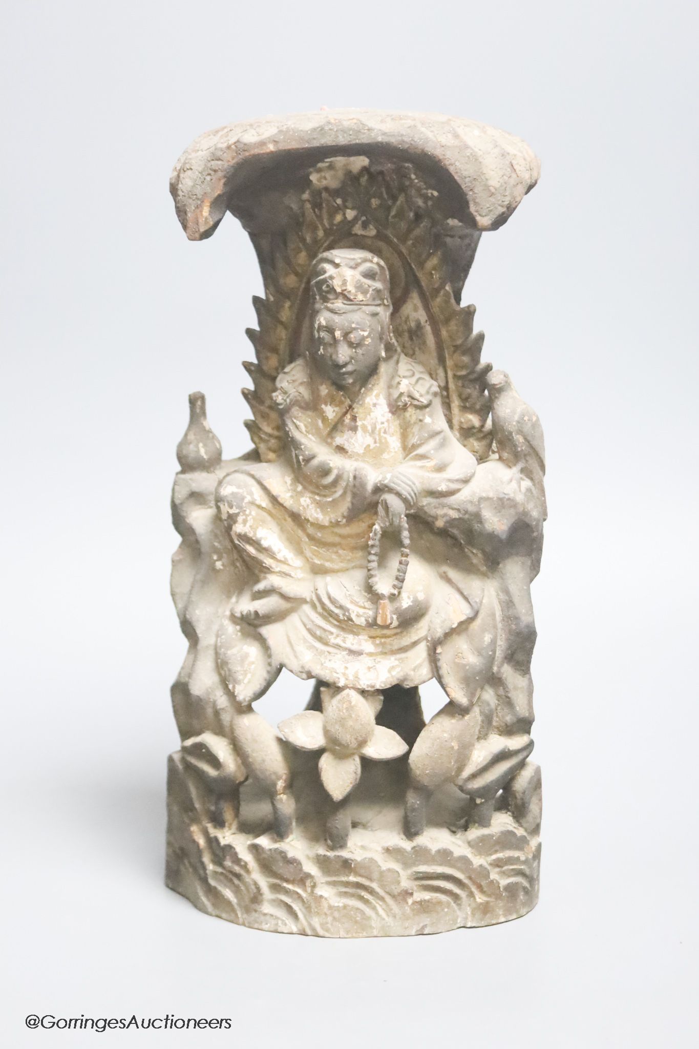 A Chinese lacquered wood seated figure of Guanyin, height 29cm